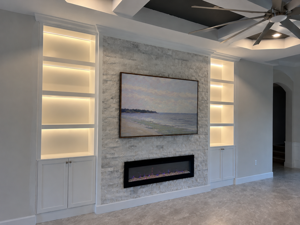 Modern Stone Fireplace TV Wall With LED Shelving modern stone fireplace TV wall with illuminated built-in shelving and recessed linear fireplace