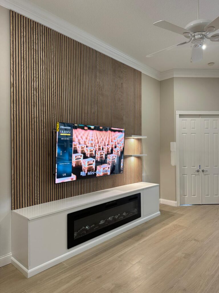 Modern panel accent wall with TV and fireplace