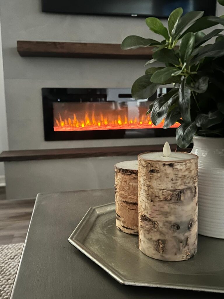Modern porcelain tile fireplace wall with electric fireplace and warm living room decor