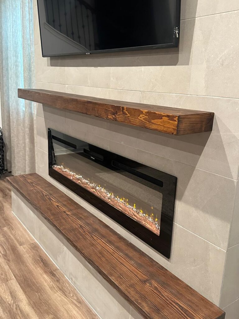 Floating wood bench detail on modern porcelain tile fireplace wall with linear electric fireplace