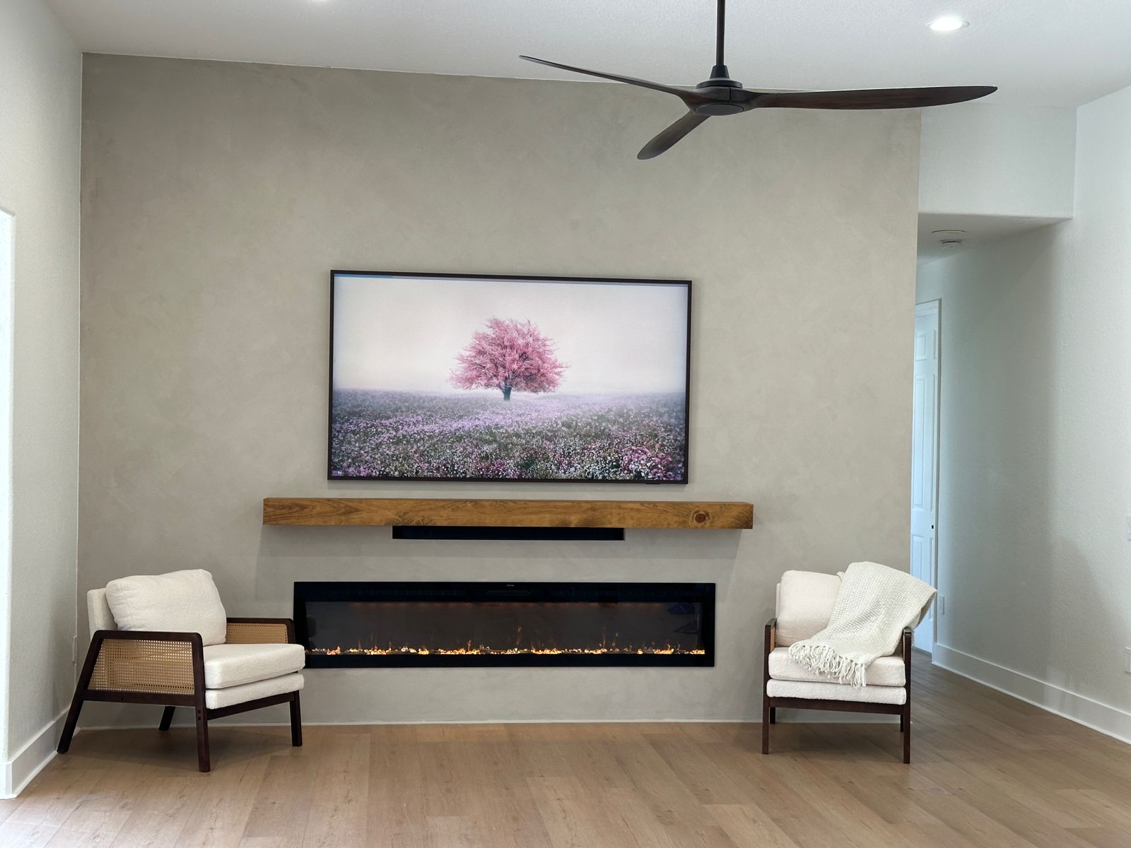 Limewash Fireplace Media Wall Limewash fireplace media wall with recessed TV, floating wood mantel, soundbar space, and oversized linear fireplace