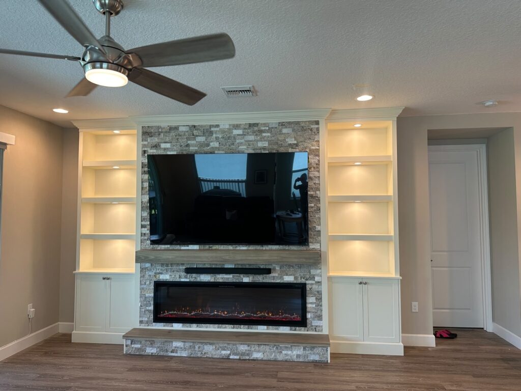 TV media wall with stone fireplace