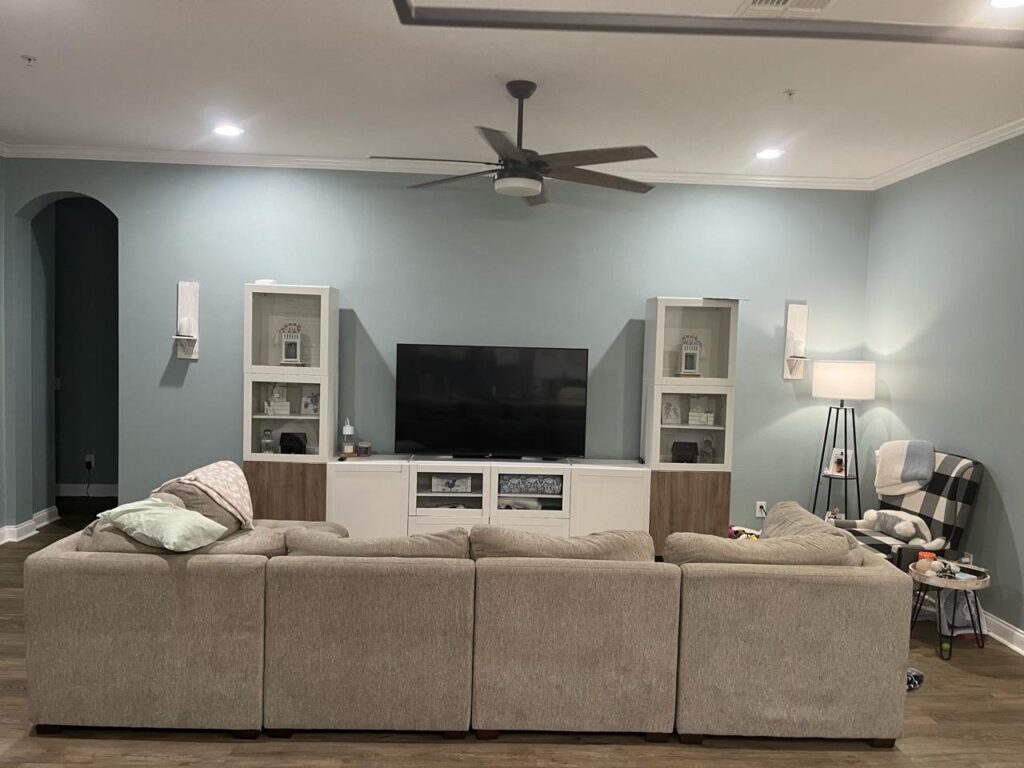White shiplap accent wall with TV mount, floating shelf, floating bench, and contemporary fireplace design