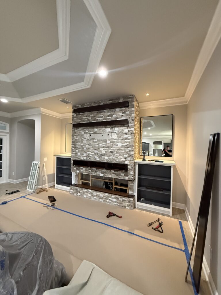 Living room wall before dark built in media wall installation