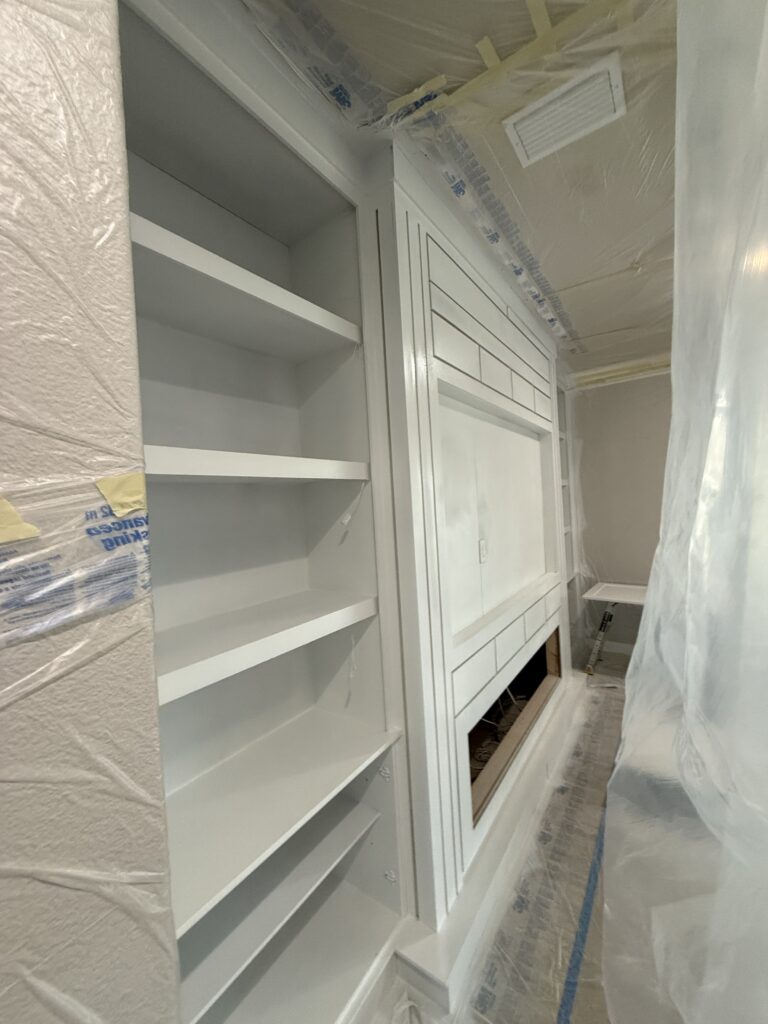Built in media wall construction with TV niche and electric fireplace space