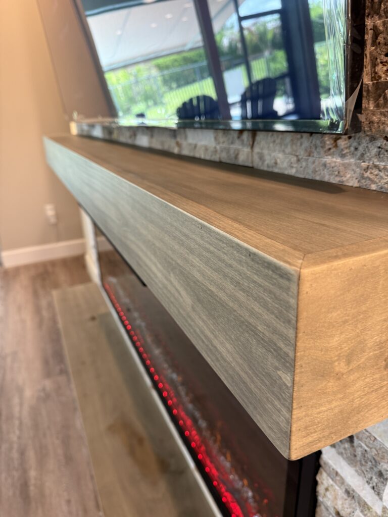 Wood mantel on TV media wall