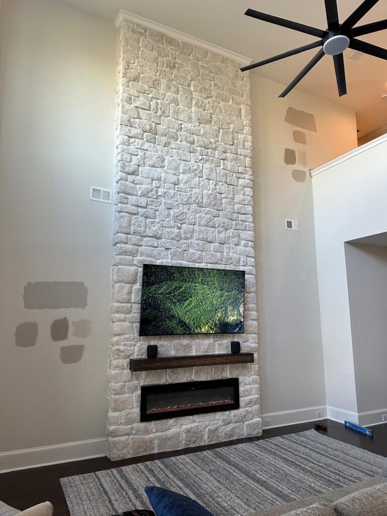 Winter Garden Stone Fireplace Wall Near Orlando Tall stone fireplace wall in Winter Garden near Orlando with TV layout and linear electric fireplace