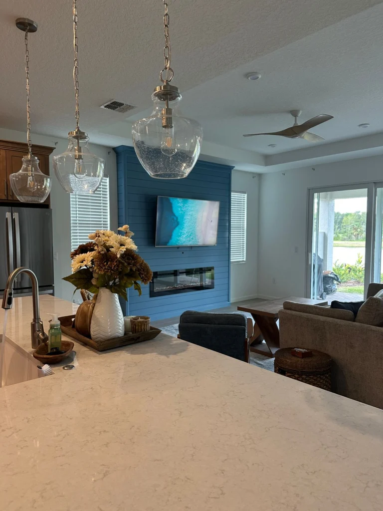 Shiplap fireplace wall Melbourne FL with TV opening and electric fireplace area