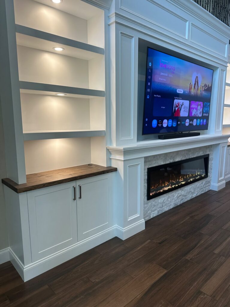 Custom built-in cabinetry and floating shelf designs designed for storage, organization, and seamless integration into luxury fireplace walls and entertainment centers. custom built in cabinetry for media wall