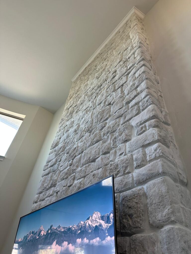 Stone Finish Detail on Winter Garden Fireplace Wall Close-up detail of stone finish on a tall custom fireplace wall project in Winter Garden
