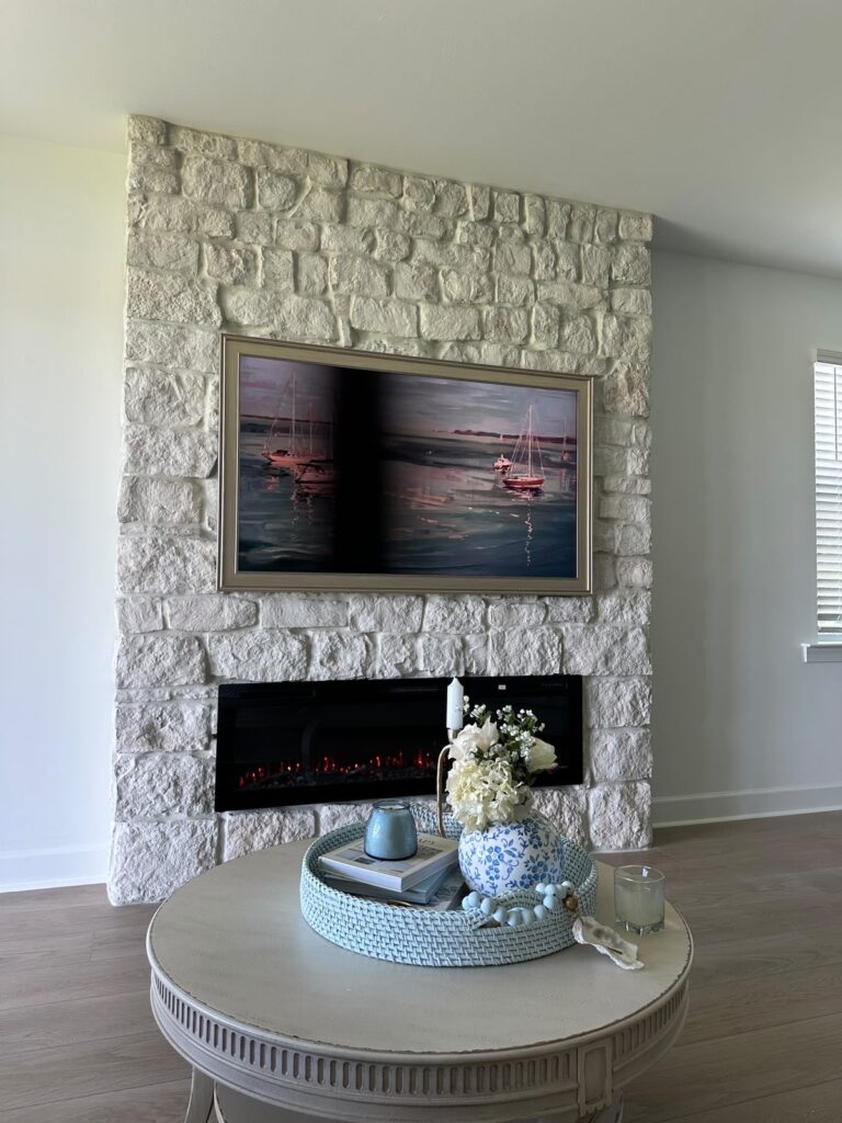 Full-height limestone fireplace wall Punta Gorda with integrated display area and electric fireplace