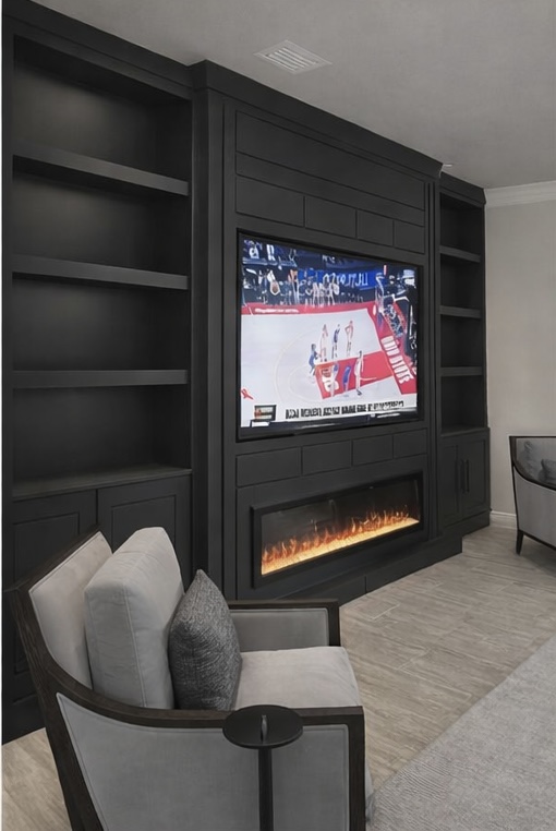 Contemporary Black Built-In Media Wall Contemporary black built-in media wall with floating shelves and recessed TV