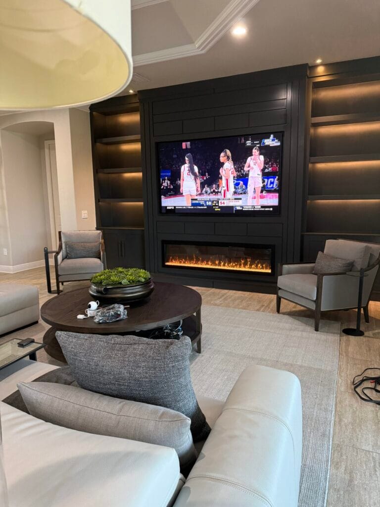 Luxury Black Entertainment Wall Luxury black entertainment wall with fireplace and illuminated shelving