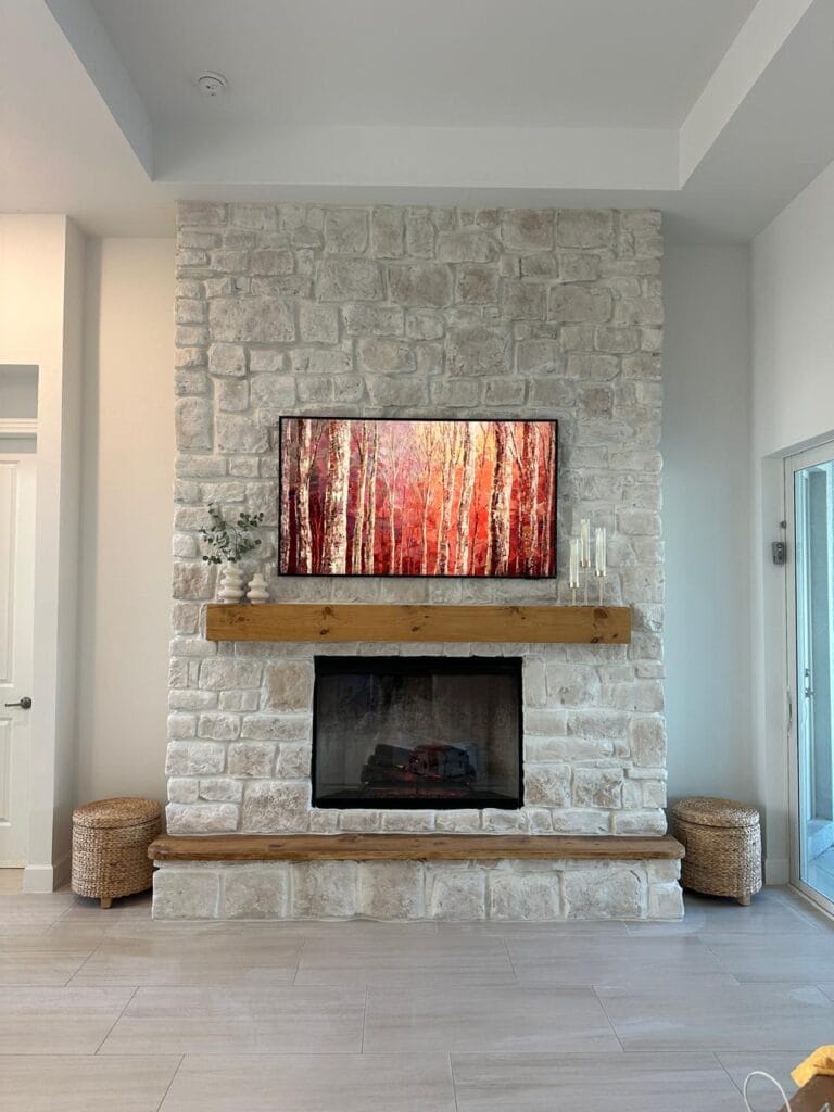 Custom Limestone Fireplace Wall Custom limestone fireplace wall with reclaimed wood mantel and raised hearth