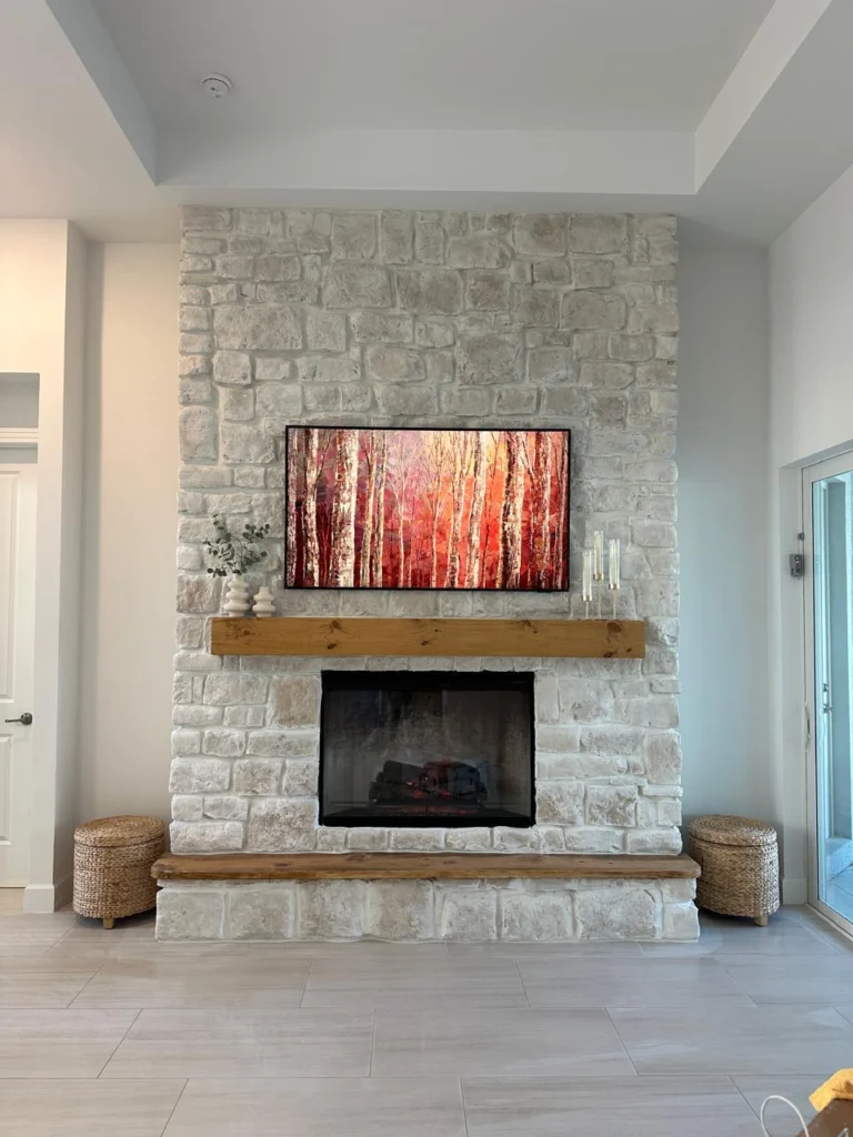 Custom Limestone Fireplace Wall Custom limestone fireplace wall with reclaimed wood mantel and raised hearth