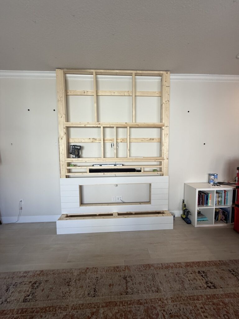 Wood framing construction for a custom sage shiplap fireplace wall in the Melbourne, Florida area