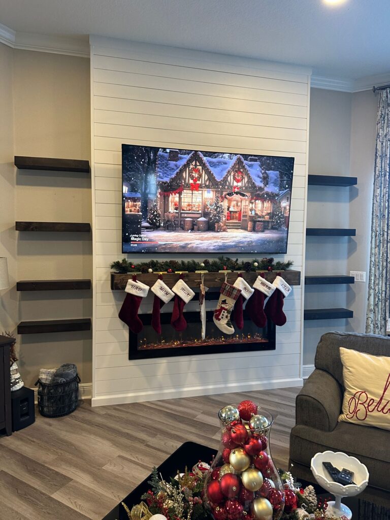 shiplap-fireplace-wall-floating-shelves-clermont.jpg Shiplap fireplace wall with floating wood shelves, custom mantel and electric fireplace in Clermont