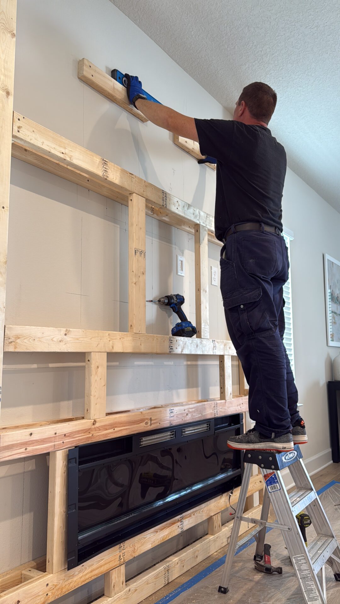 white-shiplap-fireplace-wall-framing-orlando.jpg Construction framing for a custom white shiplap fireplace wall in Orlando, Florida