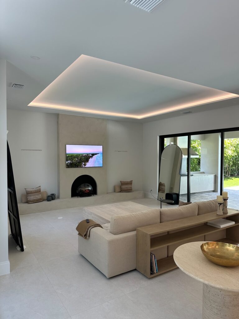 Quiet luxury living room with custom limewash fireplace wall and integrated hearth