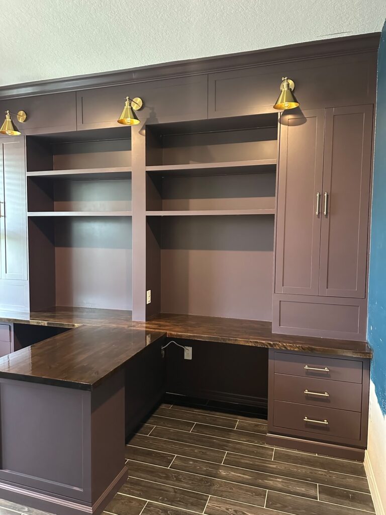 Luxury built-in home office in Orlando with custom cabinetry, wood countertops, and LED lighting by Lux Nook Design