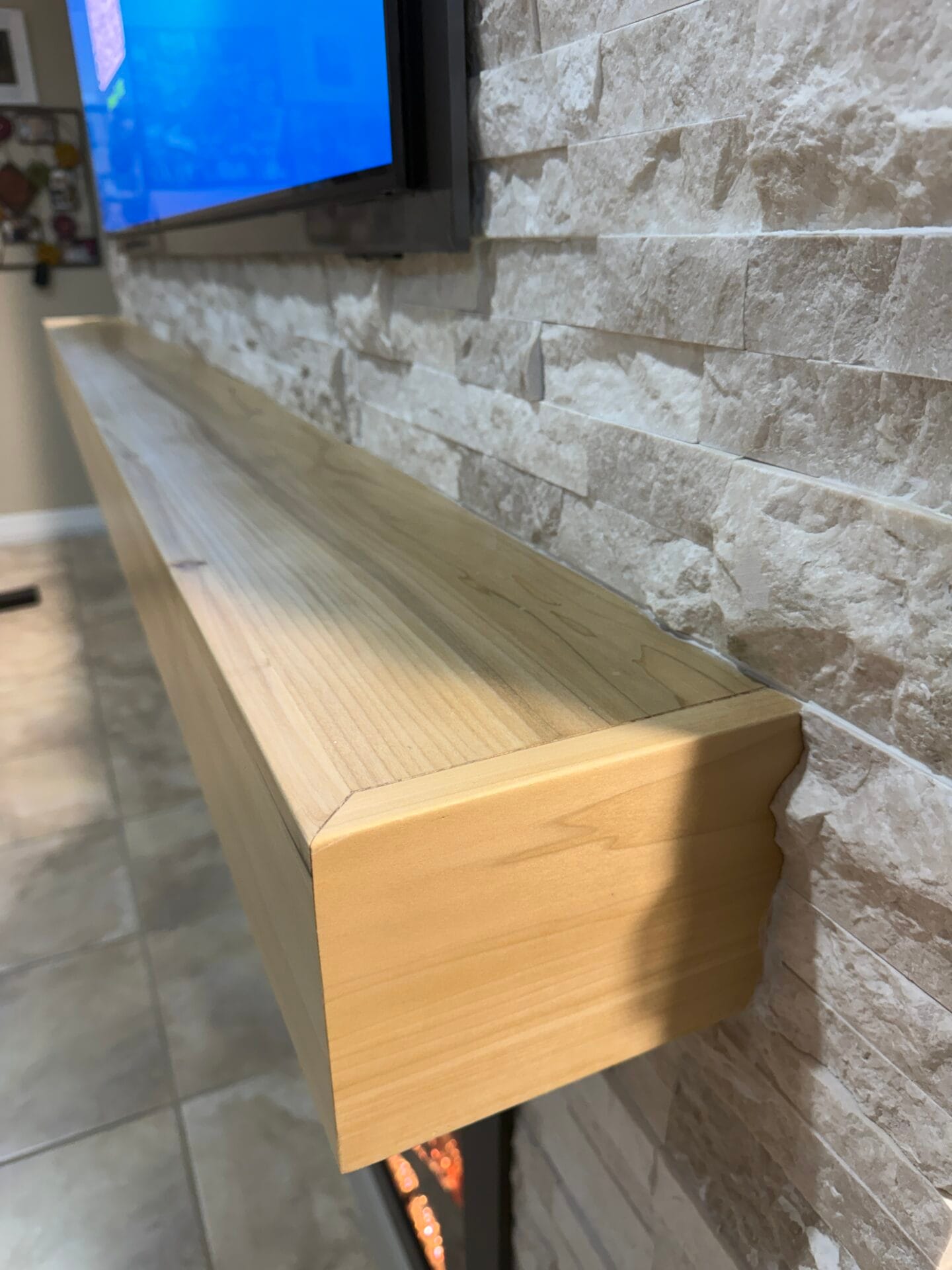 Handcrafted poplar mantel with natural stain and lacquer finish