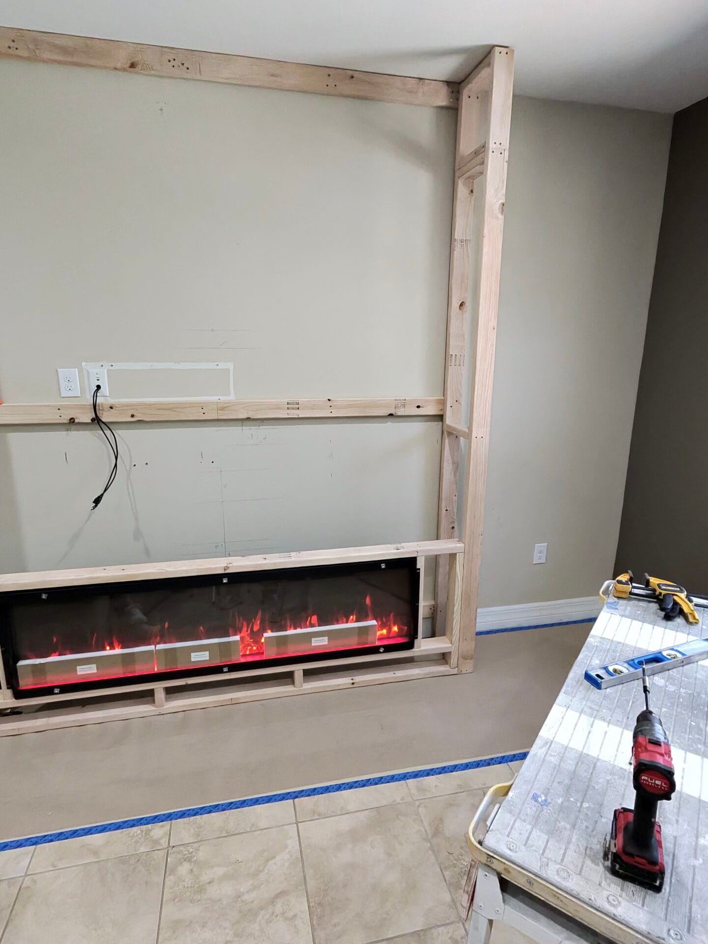 Wood framing built around a linear electric fireplace